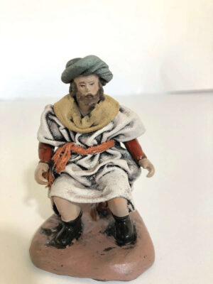 Pastore folcloristico di  buon auspicio in terracotta con  vestiti di tela cm. 10