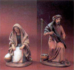 Pastorella lavandaia e pescatore in terracotta vestita